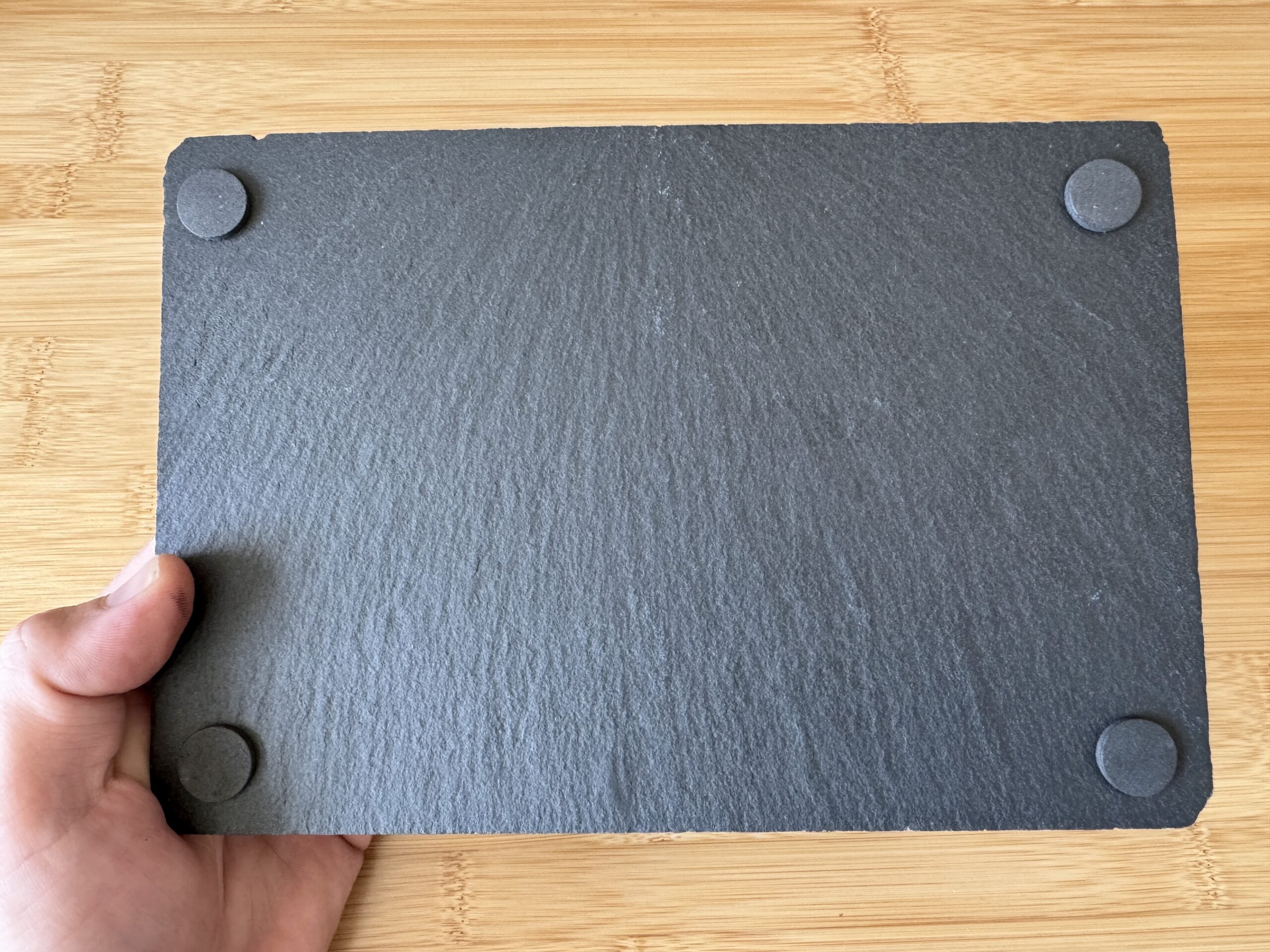 “High-contrast black and white image of a zebra with detailed stripes engraved onto a natural slate tile. The unique texture of the slate adds depth to the zebra’s distinct patterns, creating a striking, artistic effect. Perfect as a decorative piece or a custom gift from Encinitas3D.com, where technology meets nature-inspired design.”