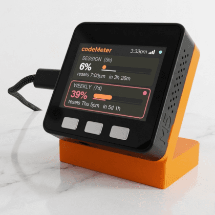 codeMeter Claude Code usage monitor by Encinitas 3D in orange stand on marble surface showing session and weekly Claude usage stats