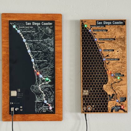 Two San Diego COASTER train maps side by side, the PCB edition and the wood honeycomb edition